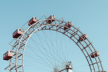 Retro Filter Of Fun Park Ferris Wheel Against Blue Sky In Vienna Prater Park