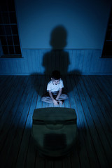 Boy watching TV at night