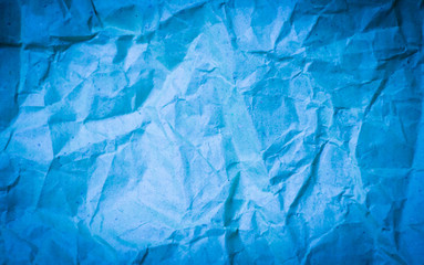 blue tint recycled paper crumble texture background with vignett