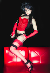 Fototapeta na wymiar Sensual girl in red corset