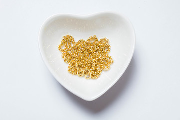 gold necklaces in heart shape bowl gift for lover or economy bus