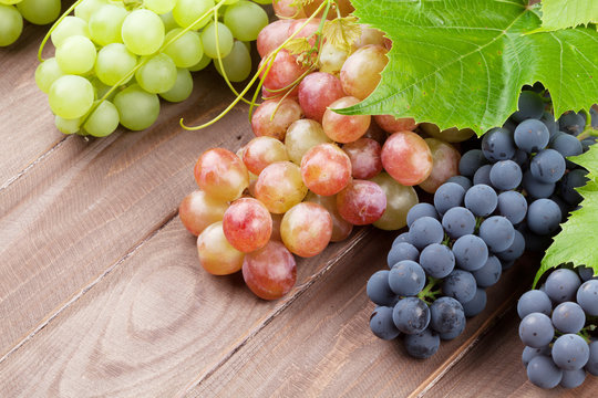 Bunch of grapes on wooden background