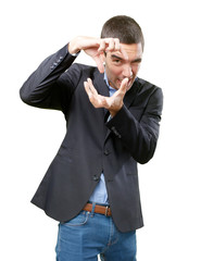 Young businessman using his hands to take a photo