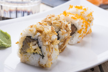Salmon and caviar rolls served on a plate