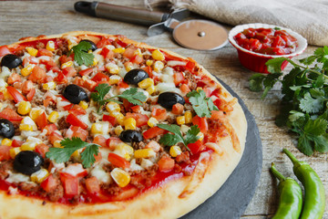 pizza with minced meat tomato cheese corn olives 
