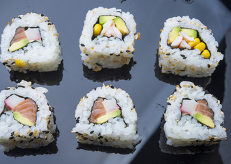 Sushi set isolated on black background