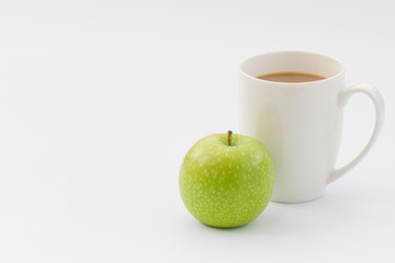 A snack of an apple and a cup of hot coffee on an isolated white background. Coffe break or tea break snack.