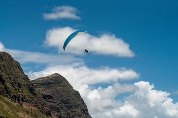 Fototapeta na wymiar paraglider in the sky in mountains