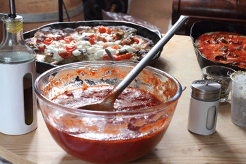 pizza and ingredients on the table