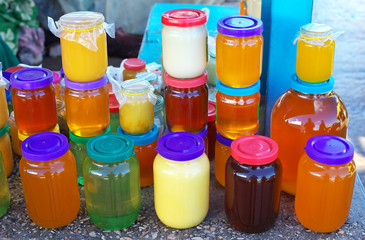 A lot of jars of honey close-up on the counter