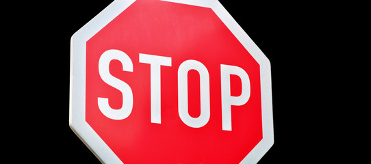 Stop traffic sign isolated black