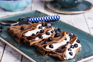chocolate crepes with cream cheese and blueberries