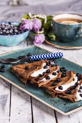 chocolate crepes with cream cheese and blueberries