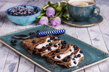 chocolate crepes with cream cheese and blueberries
