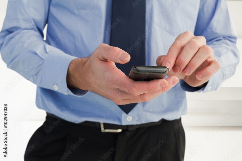 Poster composite image of close up of a businessman using a smartphone