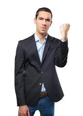 Serious businessman with strength gesture