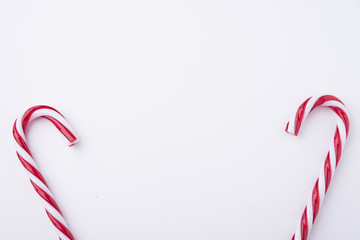 Mint hard candy cane striped in Christmas colours isolated on a