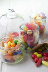 Multicolor candies in glass jars