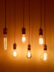 Light bulbs on warm orange background
