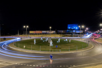 View of car streak lights at night near the airport of Faro city, Portugal.