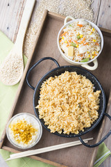 Different rice dishes (paella with vegetables, tomato and rice p