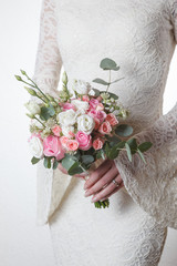 White and pink wedding bouquet of roses and lisianthus flowers