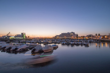 View of the peaceful marina of Faro city, Portugal at dawn.