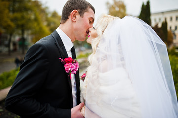 Close up portrait of happy wedding couple