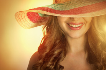 woman with a hat in the hot summer