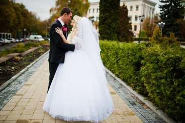 Wedding couple stay and hugging on the trail