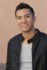 Fototapeta premium Portrait of young ethinc man smiling