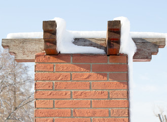 pillar of brick with wooden roof