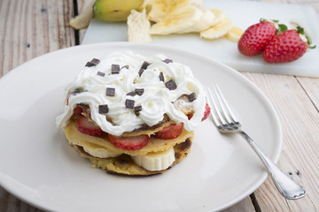 pancakes with strawberries, banana, blueberries and chocolate...