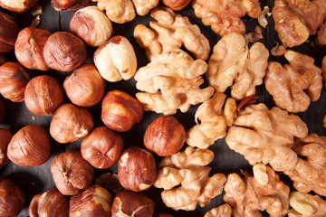 Assorted nuts in on wooden deck