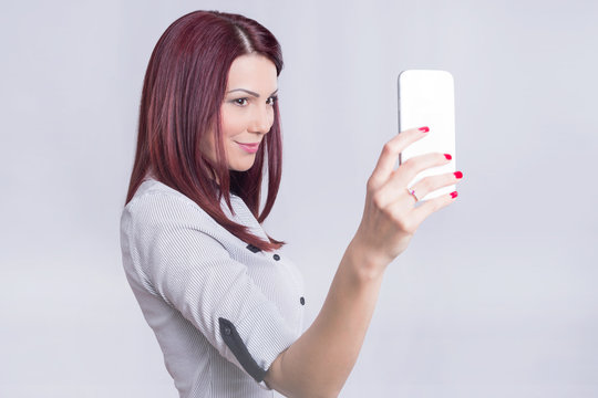 Redhead girl taking a selfie 