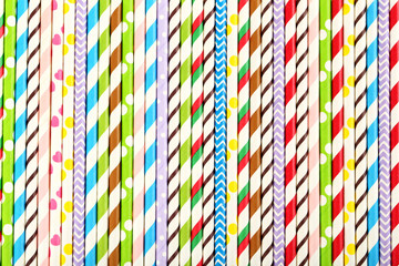 Striped drink straws background, close up