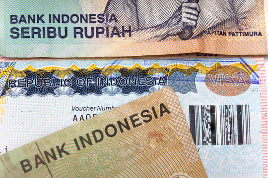 The visa of Indonesia in the passport and the Indonesian rupees