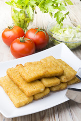 Meat croquettes served with fresh vegetables.