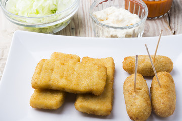 croquettes balls and different kind of sauces on a plate on a cl
