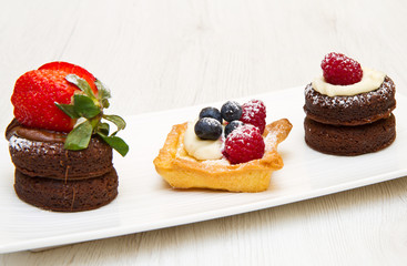 trio of cakes with fruit