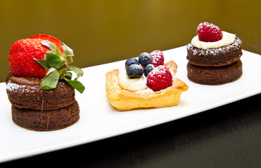 trio of cakes with fruit