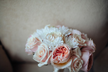 Beautiful white wedding bouquet with rings