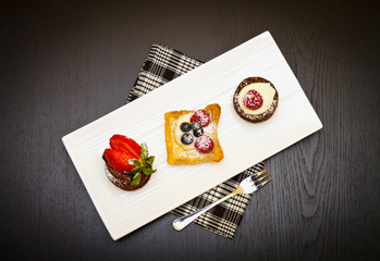trio of cakes with fruit