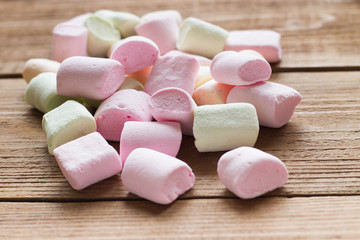 delicate, delicious marshmallows  on a wooden background