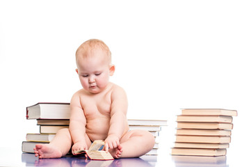 Portrait of a little girl reading books