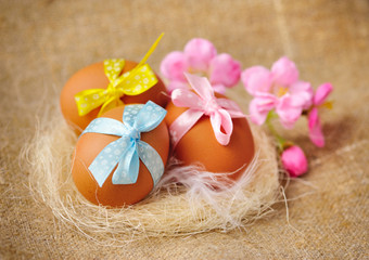 Easter eggs in the nest on a burlap