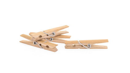 Wooden clothes pegs isolated on a white background
