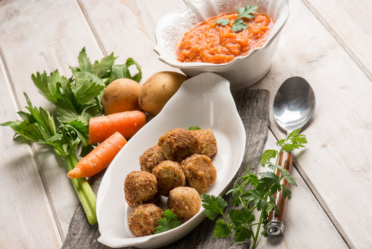 vegetarian meatballs with carrot cream sauce