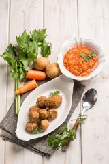 vegetarian meatballs with carrot cream sauce