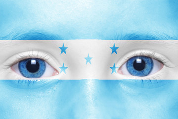 human's face with honduran flag